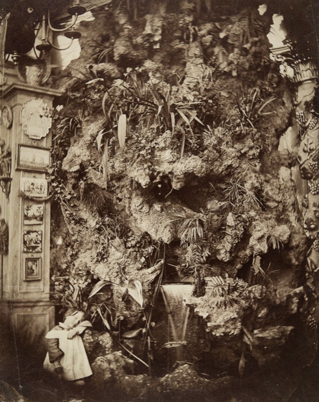 Paul Nadar posing in front of the stone-lined waterfall in the studio at the Capucines studio.