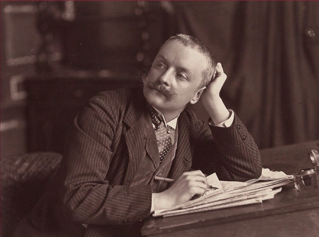 Paul, posing like his father, in the studio office on rue dAnjou,